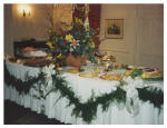 The dining table set and trimmed for a festive event